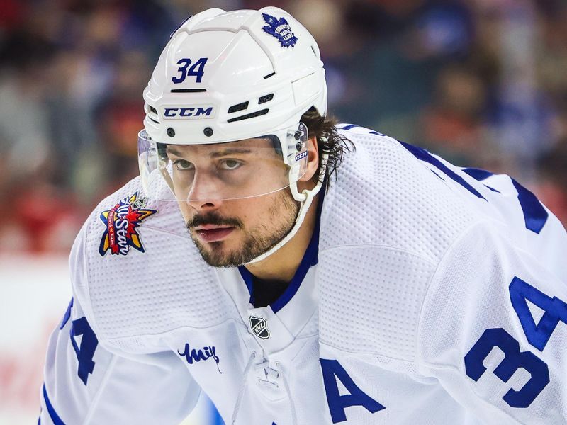 Jan 18, 2024; Calgary, Alberta, CAN; Toronto Maple Leafs center Auston Matthews (34) during the face off against the Calgary Flames during the first period at Scotiabank Saddledome. Mandatory Credit: Sergei Belski-USA TODAY Sports