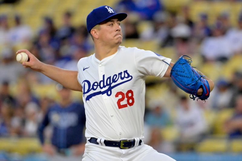 Aug 23, 2024; Los Angeles, California, USA;  Los Angeles Dodgers starting pitcher Bobby Miller (28) delivers to the plate in the first inning against the Tampa Bay Rays at Dodger Stadium. Mandatory Credit: Jayne Kamin-Oncea-USA TODAY Sports