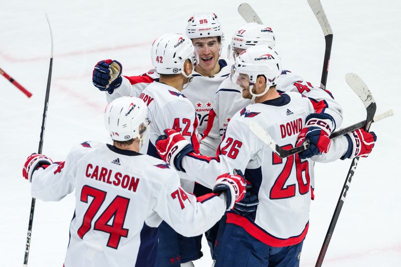 Dec 10, 2023; Chicago, Illinois, USA; Washington Capitals center Nic Dowd (26) celebrates his goal with teammates against the Chicago Blackhawks during the third period at the United Center. Mandatory Credit: Daniel Bartel-USA TODAY Sports