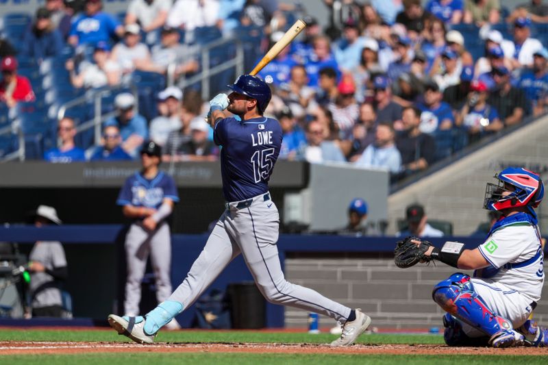 May 15, 2025; Toronto, Ontario, CAN; Tampa Bay Rays second base Josh Lowe (15) hits a home run against the Toronto Blue Jays during the fifth inning at Rogers Centre. Mandatory Credit: Kevin Sousa-Imagn Images