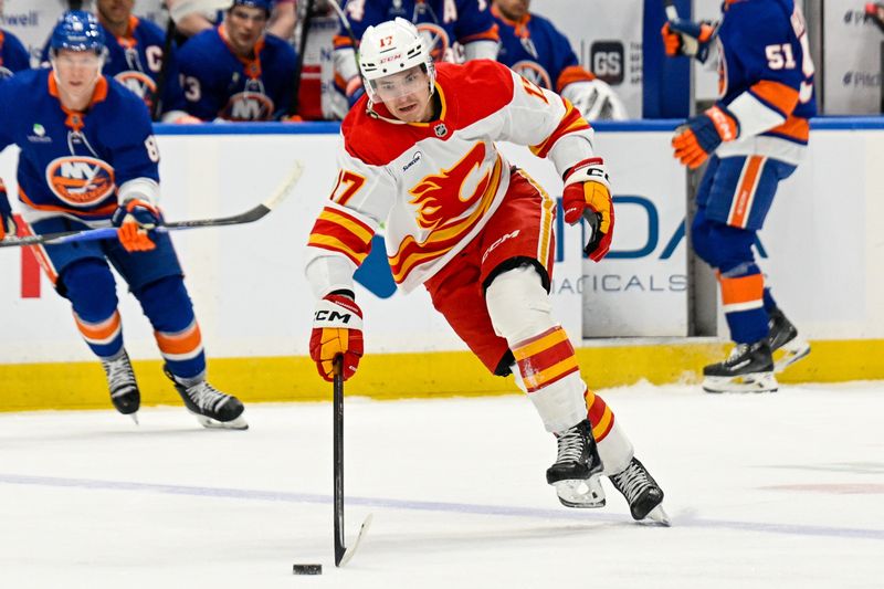 Mar 14, 2026; Elmont, New York, USA; Calgary Flames center Yegor Sharangovich (17) skates over the blue line against the New York Islanders during the first period at UBS Arena. Mandatory Credit: Dennis Schneidler-Imagn Images