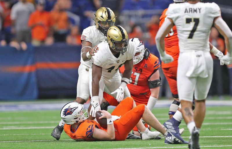 Sep 15, 2023; San Antonio, Texas, USA; Army Black Knights linebacker Jackson Powell (49) celebrates his sack of UTSA Roadrunners quarterback Eddie Lee Marburger (12) during the second half at the Alamodome. Mandatory Credit: Danny Wild-USA TODAY Sports