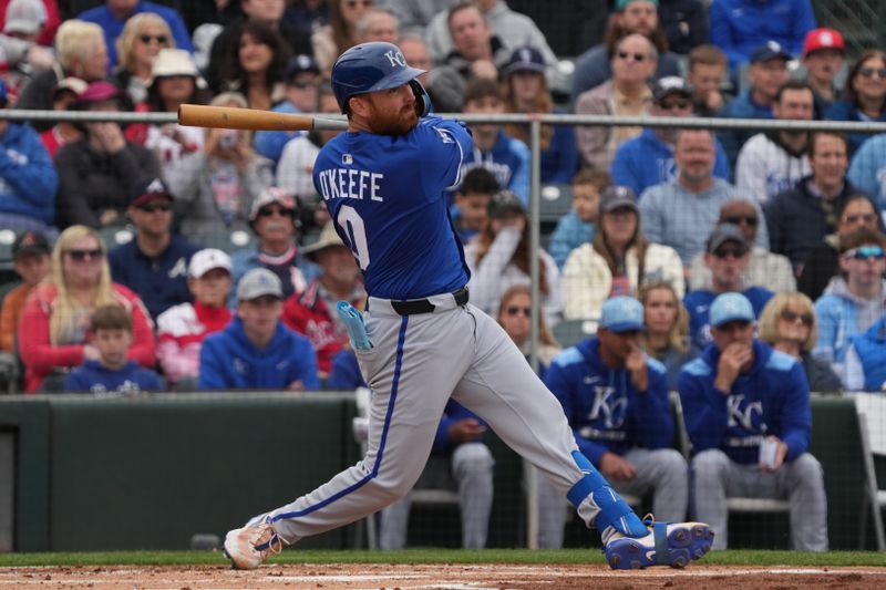 Mar 14, 2025; Tempe, Arizona, USA; Kansas City Royals catcher Brian Okeefe hits a single against the Los Angeles Angels in the second inning at Tempe Diablo Stadium. Mandatory Credit: Rick Scuteri-Imagn Images