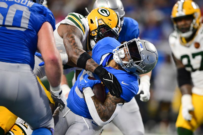 Detroit Lions running back David Montgomery is tackled during the second half of an NFL football game against the Green Bay Packers, Thursday, Nov. 23, 2023, in Detroit. (AP Photo/David Dermer)