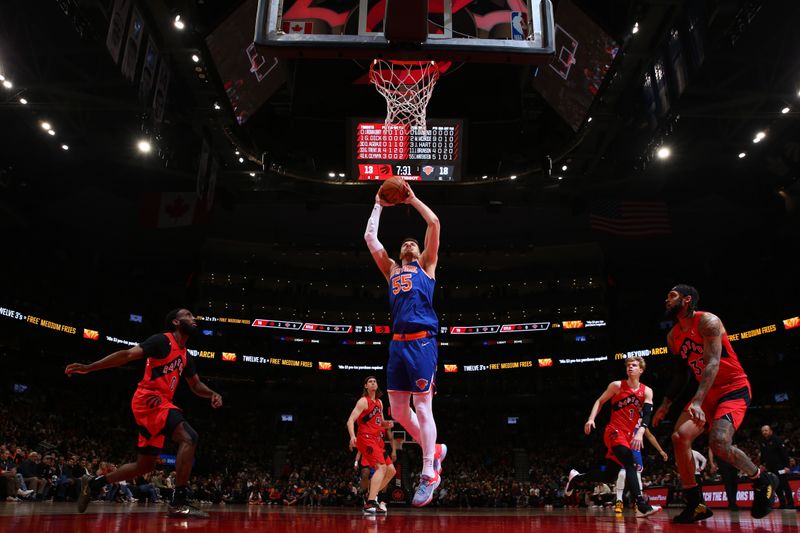 TORONTO, CANADA - MARCH 27: Isaiah Hartenstein #55 of the New York Knicks dunks the ball during the game against the Toronto Raptors on March 27, 2024 at the Scotiabank Arena in Toronto, Ontario, Canada.  NOTE TO USER: User expressly acknowledges and agrees that, by downloading and or using this Photograph, user is consenting to the terms and conditions of the Getty Images License Agreement.  Mandatory Copyright Notice: Copyright 2024 NBAE (Photo by Vaughn Ridley/NBAE via Getty Images)