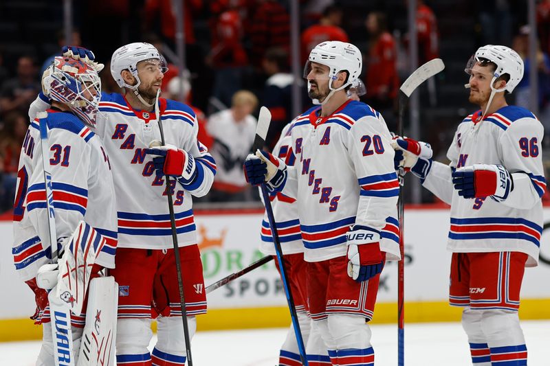 Apr 26, 2024; Washington, District of Columbia, USA; New York Rangers goaltender Igor Shesterkin (31) celebrates with teammates after their game against the Washington Capitals in game three of the first round of the 2024 Stanley Cup Playoffs at Capital One Arena. Mandatory Credit: Geoff Burke-USA TODAY Sports