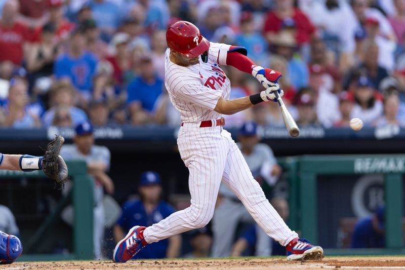 Jul 9, 2024; Philadelphia, Pennsylvania, USA; Philadelphia Phillies shortstop Trea Turner (7) hits a single during the first inning against the Los Angeles Dodgers at Citizens Bank Park. Mandatory Credit: Bill Streicher-USA TODAY Sports