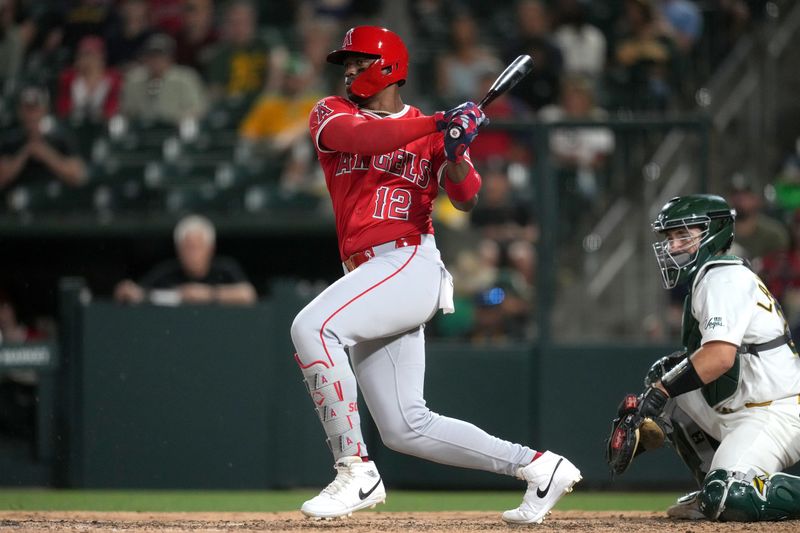 May 21, 2025; West Sacramento, Los Angeles Angels designated hitter Jorge Soler (12) hits a RBI double against the Athletics in the eighth inning at Sutter Health Park. Mandatory Credit: Cary Edmondson-Imagn Images
