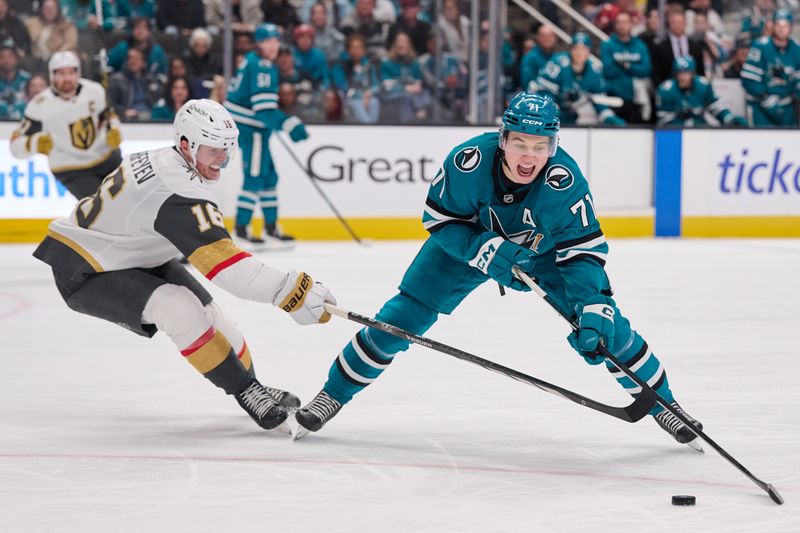 Jan 11, 2026; San Jose, California, USA; San Jose Sharks center Macklin Celebrini (71) plays the puck against Vegas Golden Knights right wing Pavel Dorofeyev (16) during the second period at SAP Center at San Jose. Mandatory Credit: Robert Edwards-Imagn Images