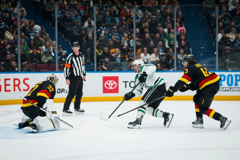 Nov 20, 2025; Vancouver, British Columbia, CAN; Vancouver Canucks defenseman Quinn Hughes (43) watches as Dallas Stars forward Colin Blackwell (15) scores on goalie Kevin Lankinen (32) in the third period at Rogers Arena. Mandatory Credit: Bob Frid-Imagn Images