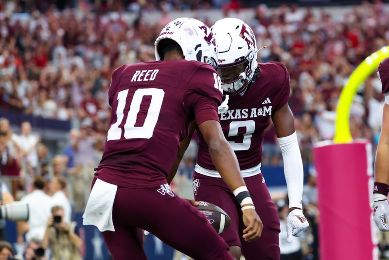 Sep 28, 2024; Arlington, Texas, USA; Texas A&M Aggies quarterback Marcel Reed (10) celebrates with Texas A&M Aggies wide receiver Jahdae Walker (9) after scoring a touchdown during the first half against the Arkansas Razorbacks at AT&T Stadium. Mandatory Credit: Kevin Jairaj-Imagn Images