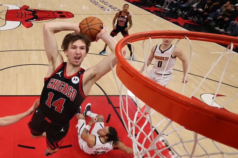 CHICAGO, ILLINOIS - JANUARY 27: Matas Buzelis #14 of the Chicago Bulls goes up for a dunk against the Denver Nuggets during the second half at the United Center on January 27, 2025 in Chicago, Illinois. NOTE TO USER: User expressly acknowledges and agrees that, by downloading and or using this photograph, User is consenting to the terms and conditions of the Getty Images License Agreement.  (Photo by Michael Reaves/Getty Images)