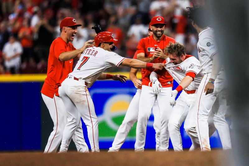 Jun 24, 2025; Cincinnati, Ohio, USA; Cincinnati Reds outfielder Spencer Steer (7) celebrates after pinch hitter Gavin Lux (2) hit a walk-off single in the eleventh inning against the New York Yankees at Great American Ball Park. Mandatory Credit: Katie Stratman-Imagn Images