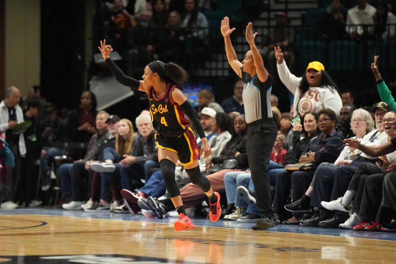 Mar 10, 2024; Las Vegas, NV, USA; USC Trojans guard Kayla Williams (4) celebrates after a three-point basket against the Stanford Cardinal jn the first half of the Pac-12 Tournament women's championship game at MGM Grand Garden Arena. Mandatory Credit: Kirby Lee-USA TODAY Sports