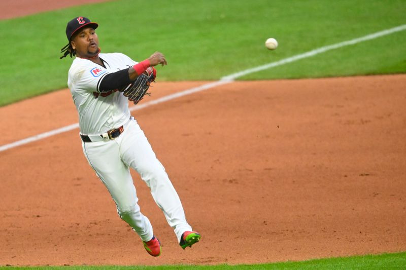 May 6, 2024; Cleveland, Ohio, USA; Cleveland Guardians third baseman Jose Ramirez (11) throws to first base in the eighth inning against the Detroit Tigers at Progressive Field. Mandatory Credit: David Richard-USA TODAY Sports