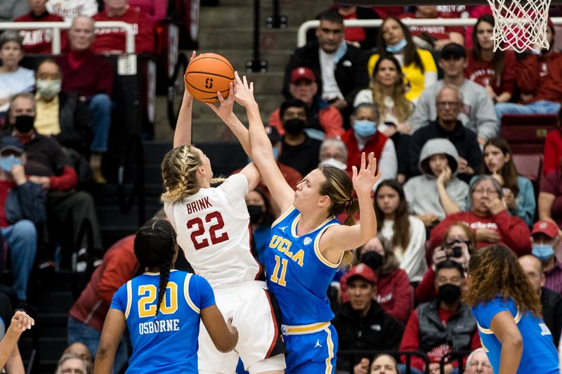 Feb 20, 2023; Stanford, California, USA;  UCLA Bruins forward Emily Bessoir (11) fouls Stanford Cardinal forward Cameron Brink (22) during the second half at Maples Pavilion. Mandatory Credit: John Hefti-USA TODAY Sports