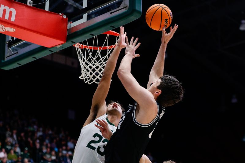 Feb 4, 2023; Fort Collins, Colorado, USA; Utah State Aggies center Trevin Dorius (32) attempts a shot against Colorado State Rams guard Isaiah Rivera (23) in the first half at Moby Arena. Mandatory Credit: Isaiah J. Downing-USA TODAY Sports