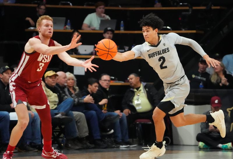 Jan 22, 2023; Boulder, Colorado, USA; Colorado Buffaloes guard KJ Simpson (2) steals a pass intended for Washington State Cougars guard Jabe Mullins (3) in the first half at the CU Events Center. Mandatory Credit: Ron Chenoy-USA TODAY Sports