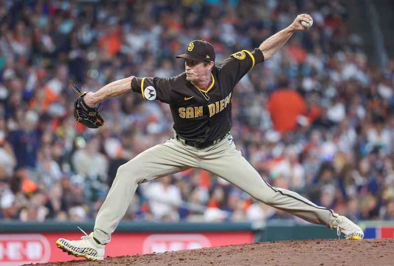 Sep 10, 2023; Houston, Texas, USA; San Diego Padres relief pitcher Tim Hill (25) delivers a pitch during the sixth inning against the Houston Astros at Minute Maid Park. Mandatory Credit: Troy Taormina-USA TODAY Sports