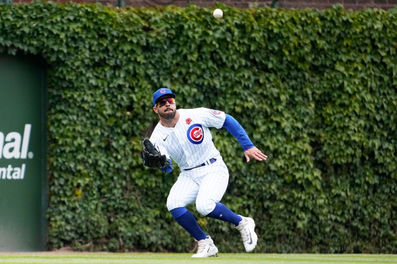 May 29, 2023; Chicago, Illinois, USA; Chicago Cubs center fielder Mike Tauchman (40) makes a catch on Tampa Bay Rays second baseman Brandon Lowe (8) during the first inning at Wrigley Field. Mandatory Credit: David Banks-USA TODAY Sports