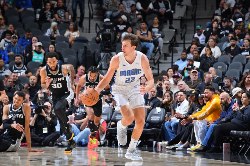 SAN ANTONIO, TX - JANUARY 31: Franz Wagner #22 of the Orlando Magic dribbles the ball during the game against the San Antonio Spurs on January 31, 2024 at the Frost Bank Center in San Antonio, Texas. NOTE TO USER: User expressly acknowledges and agrees that, by downloading and or using this photograph, user is consenting to the terms and conditions of the Getty Images License Agreement. Mandatory Copyright Notice: Copyright 2024 NBAE (Photos by Michael Gonzales/NBAE via Getty Images)