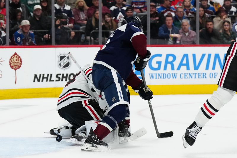 Mar 4, 2024; Denver, Colorado, USA; Colorado Avalanche left wing Zach Parise (9) scores on Chicago Blackhawks goaltender Petr Mrazek (34) in the second period at Ball Arena. Mandatory Credit: Ron Chenoy-USA TODAY Sports