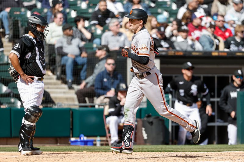 Apr 6, 2023; Chicago, Illinois, USA; San Francisco Giants center fielder Mike Yastrzemski (5) crosses home plate after hitting a two-run home run against the Chicago White Sox during the fifth inning at Guaranteed Rate Field. Mandatory Credit: Kamil Krzaczynski-USA TODAY Sports