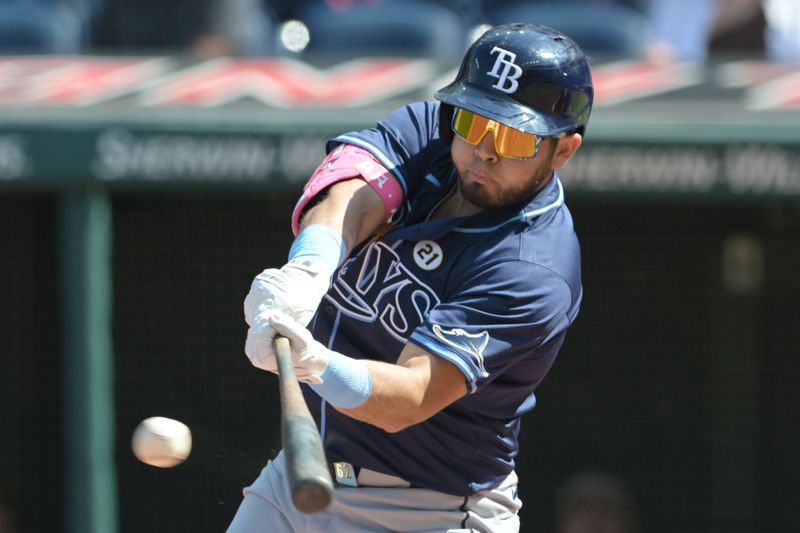 Sep 15, 2024; Cleveland, Ohio, USA; Tampa Bay Rays first baseman Jonathan Aranda (62) hits a single during the first inning against the Cleveland Guardians at Progressive Field. Mandatory Credit: Ken Blaze-Imagn Images