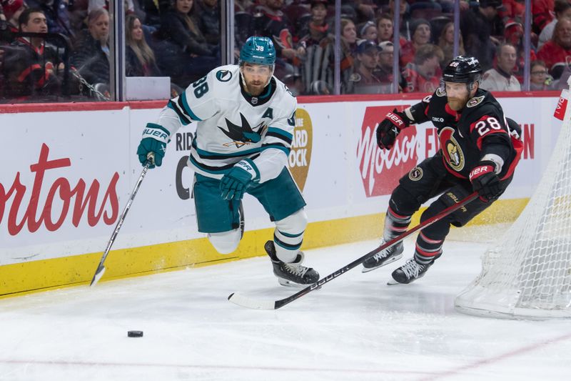 Jan 13, 2024; Ottawa, Ontario, CAN; San Jose Sharks defenseman Mario Ferraro (38) and Ottawa Senators right wing Claude Giroux (29) chase the puck in the first period at the Canadian Tire Centre. Mandatory Credit: Marc DesRosiers-USA TODAY Sports