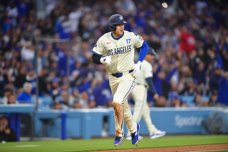 Apr 26, 2025; Los Angeles, California, USA; Los Angeles Dodgers designated hitter Shohei Ohtani (17) runs home to score against the Pittsburgh Pirates during the fifth inning at Dodger Stadium. Mandatory Credit: Gary A. Vasquez-Imagn Images