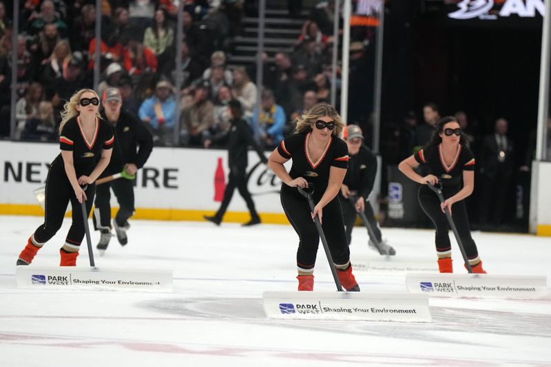 Feb 15, 2023; Anaheim, California, USA; Anaheim Ducks power player ice crew members clear the ice against the Buffalo Sabres in the second period at Honda Center. Mandatory Credit: Kirby Lee-USA TODAY Sports