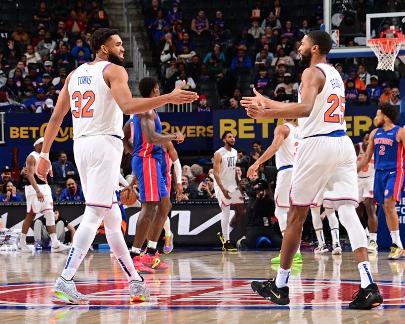 DETROIT, MI - NOVEMBER 1: Karl-Anthony Towns #32 and Mikal Bridges #25 of the New York Knicks high five during the game against the Detroit Pistons on November 1, 2024 at Little Caesars Arena in Detroit, Michigan. NOTE TO USER: User expressly acknowledges and agrees that, by downloading and/or using this photograph, User is consenting to the terms and conditions of the Getty Images License Agreement. Mandatory Copyright Notice: Copyright 2024 NBAE (Photo by Chris Schwegler/NBAE via Getty Images)