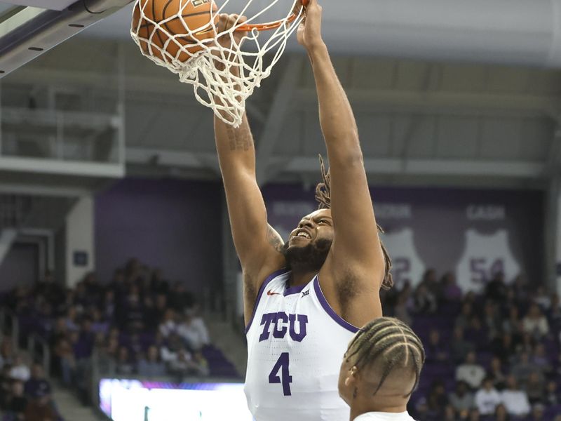 Jan 14, 2023; Fort Worth, Texas, USA;  TCU Horned Frogs center Eddie Lampkin Jr. (4) dunks over Kansas State Wildcats forward Keyontae Johnson (11) during the first half at Ed and Rae Schollmaier Arena. Mandatory Credit: Kevin Jairaj-USA TODAY Sports