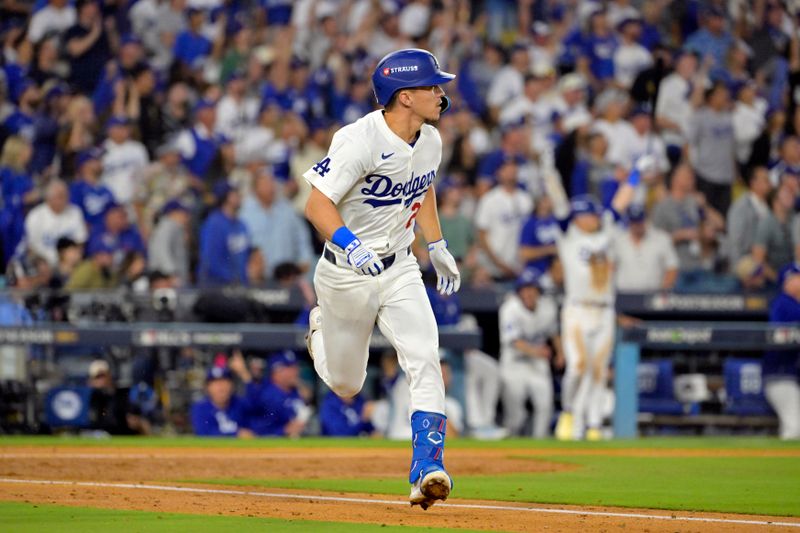 Oct 20, 2024; Los Angeles, California, USA; Los Angeles Dodgers shortstop Tommy Edman (25) runs after hitting a two run home run in the third inning against the New York Mets during game six of the NLCS for the 2024 MLB playoffs at Dodger Stadium. Mandatory Credit: Jayne Kamin-Oncea-Imagn Images