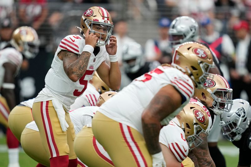 San Francisco 49ers quarterback Trey Lance (5) plays against the Las Vegas Raiders during an NFL football game, Sunday, Aug. 13, 2023, in Las Vegas. (AP Photo/John Locher)