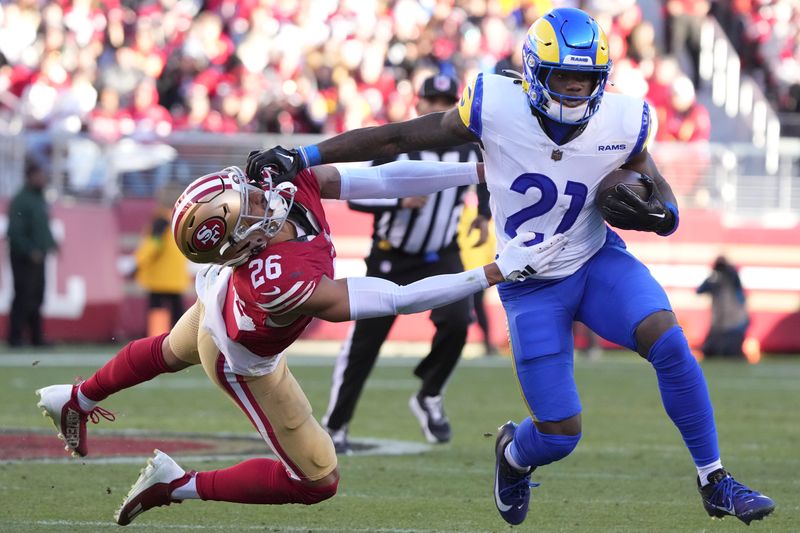 Los Angeles Rams running back Zach Evans (21) runs against San Francisco 49ers cornerback Isaiah Oliver (26) during the second half of an NFL football game in Santa Clara, Calif., Sunday, Jan. 7, 2024. (AP Photo/Loren Elliott)