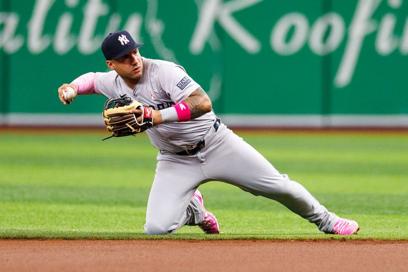 May 12, 2024; St. Petersburg, Florida, USA;  New York Yankees second baseman Gleyber Torres (25) throws to first base fro an out against the Tampa Bay Rays in the first inning ‘‘‘‘‘at Tropicana Field. Mandatory Credit: Nathan Ray Seebeck-USA TODAY Sports