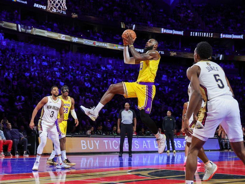 LAS VEGAS, NEVADA - DECEMBER 07: LeBron James #23 of the Los Angeles Lakers drives in for a layup against the New Orleans Pelicans in the first half of the West semifinal game of the inaugural NBA In-Season Tournament at T-Mobile Arena on December 07, 2023 in Las Vegas, Nevada. NOTE TO USER: User expressly acknowledges and agrees that, by downloading and or using this photograph, User is consenting to the terms and conditions of the Getty Images License Agreement.  (Photo by Ethan Miller/Getty Images)