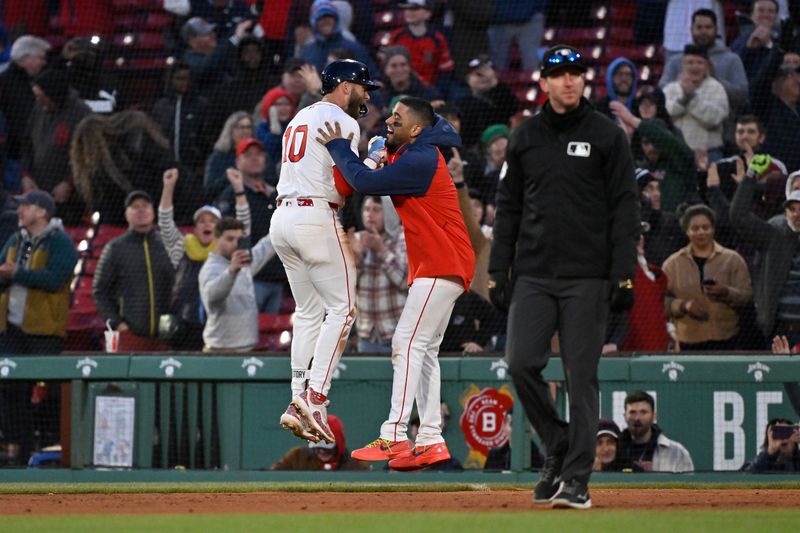 Apr 10, 2025; Boston, Massachusetts, USA; Boston Red Sox shortstop Trevor Story (10) celebrates his game winning RBI against the Toronto Blue Jays with catcher Carlos Narvaez (75) during the tenth inning at Fenway Park. Mandatory Credit: Eric Canha-Imagn Images