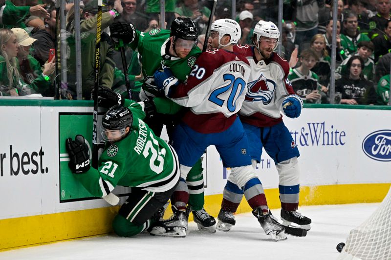 May 7, 2024; Dallas, Texas, USA; Dallas Stars left wing Jason Robertson (21) and center Radek Faksa (12) and Colorado Avalanche center Ross Colton (20) and defenseman Samuel Girard (49) battle for control of the puck during the overtime period in game one of the second round of the 2024 Stanley Cup Playoffs at American Airlines Center. Mandatory Credit: Jerome Miron-USA TODAY Sports