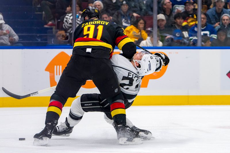 Mar 25, 2024; Vancouver, British Columbia, CAN;  Vancouver Canucks defenseman Nikita Zadorov (91) checks Los Angeles Kings forward Kevin Fiala (22) in the second period  at Rogers Arena. Mandatory Credit: Bob Frid-USA TODAY Sports