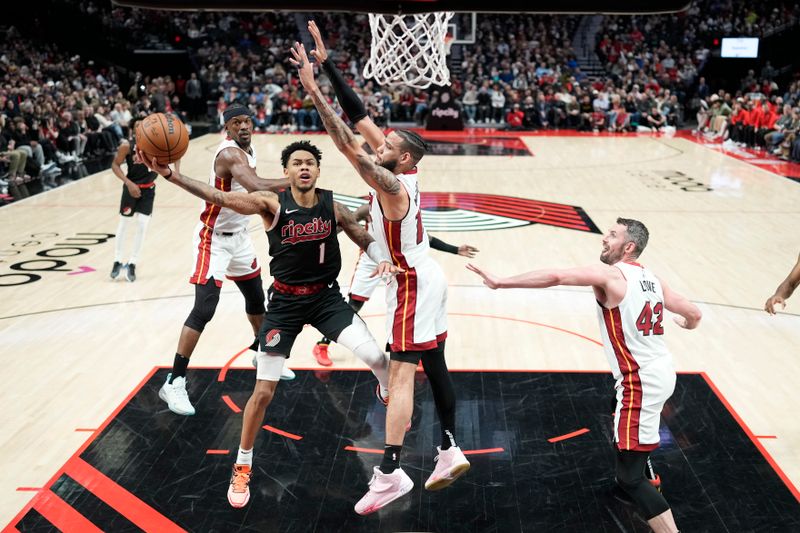 PORTLAND, OREGON - FEBRUARY 27: Anfernee Simons #1 of the Portland Trail Blazers shoots the ball against Caleb Martin #16 (R) of the Miami Heat during the second half at Moda Center on February 27, 2024 in Portland, Oregon. NOTE TO USER: User expressly acknowledges and agrees that, by downloading and or using this photograph, User is consenting to the terms and conditions of the Getty Images License Agreement. (Photo by Soobum Im/Getty Images)