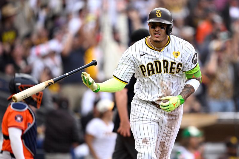 Sep 18, 2024; San Diego, California, USA; San Diego Padres third baseman Manny Machado (13) tosses his bat after hitting a home run against the Houston Astros during the sixth inning at Petco Park. Mandatory Credit: Orlando Ramirez-Imagn Images