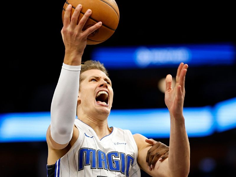 MINNEAPOLIS, MINNESOTA - FEBRUARY 02: Moritz Wagner #21 of the Orlando Magic is fouled by Naz Reid #11 of the Minnesota Timberwolves in the fourth quarter at Target Center on February 02, 2024 in Minneapolis, Minnesota. The Magic defeated the Timberwolves 108-106. NOTE TO USER: User expressly acknowledges and agrees that, by downloading and or using this photograph, User is consenting to the terms and conditions of the Getty Images License Agreement. (Photo by David Berding/Getty Images)