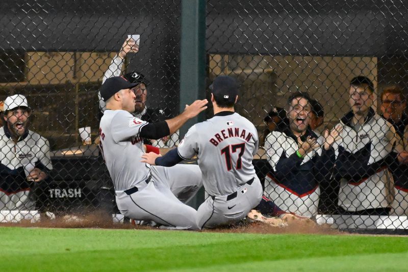 May 11, 2024; Chicago, Illinois, USA;  Cleveland Guardians outfielder Ramón Laureano (10) and  outfielder Will Brennan (17) cannot make a play on a ball hit for a  double hit by Chicago White Sox designated hitter Eloy Jiménez (not pictured) during the eighth inning at Guaranteed Rate Field. Mandatory Credit: Matt Marton-USA TODAY Sports