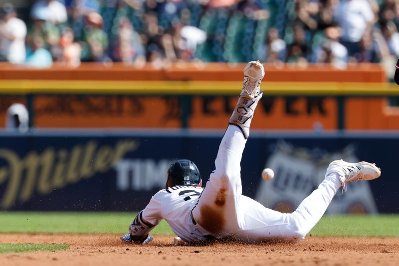 Sep 18, 2025; Detroit, Michigan, USA;  Detroit Tigers first base Spencer Torkelson (20) dives into second after he hits a double in the second inning against the Cleveland Guardians at Comerica Park. Mandatory Credit: Rick Osentoski-Imagn Images