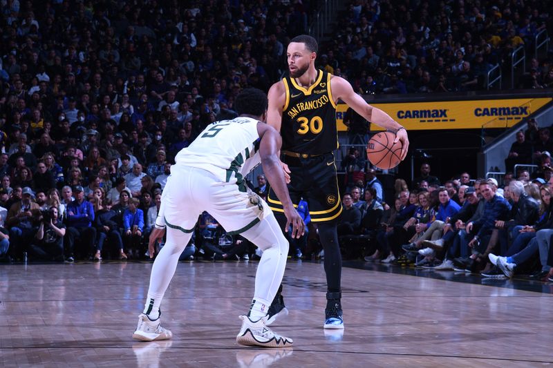 SAN FRANCISCO, CA - MARCH 6:  Stephen Curry #30 of the Golden State Warriors handles the ball during the game against the Milwaukee Bucks on MARCH 6, 2024 at Chase Center in San Francisco, California. NOTE TO USER: User expressly acknowledges and agrees that, by downloading and or using this photograph, user is consenting to the terms and conditions of Getty Images License Agreement. Mandatory Copyright Notice: Copyright 2024 NBAE (Photo by Noah Graham/NBAE via Getty Images)