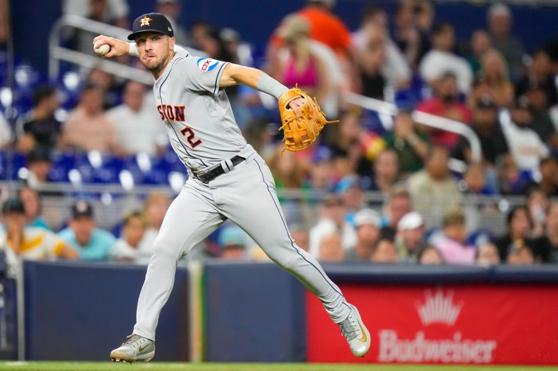 Aug 16, 2023; Miami, Florida, USA; Houston Astros third baseman Alex Bregman (2) throws the ball to first base for an out against the Miami Marlins during the seventh inning at loanDepot Park. Mandatory Credit: Rich Storry-USA TODAY Sports