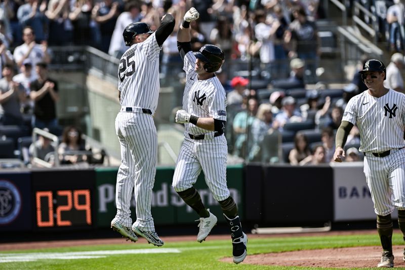 May 19, 2024; Bronx, New York, USA; New York Yankees third baseman Jon Berti (19) is greeted at home plate by New York Yankees second baseman Gleyber Torres (25) after hitting a three run home run against the Chicago White Sox during the fourth inning at Yankee Stadium. Mandatory Credit: John Jones-USA TODAY Sports