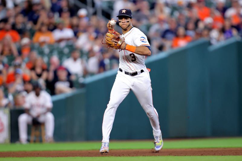 Jun 26, 2024; Houston, Texas, USA; Houston Astros shortstop Jeremy Pena (3) throws a fielded ball to first base for an out against the Colorado Rockies during the seventh inning at Minute Maid Park. Mandatory Credit: Erik Williams-USA TODAY Sports